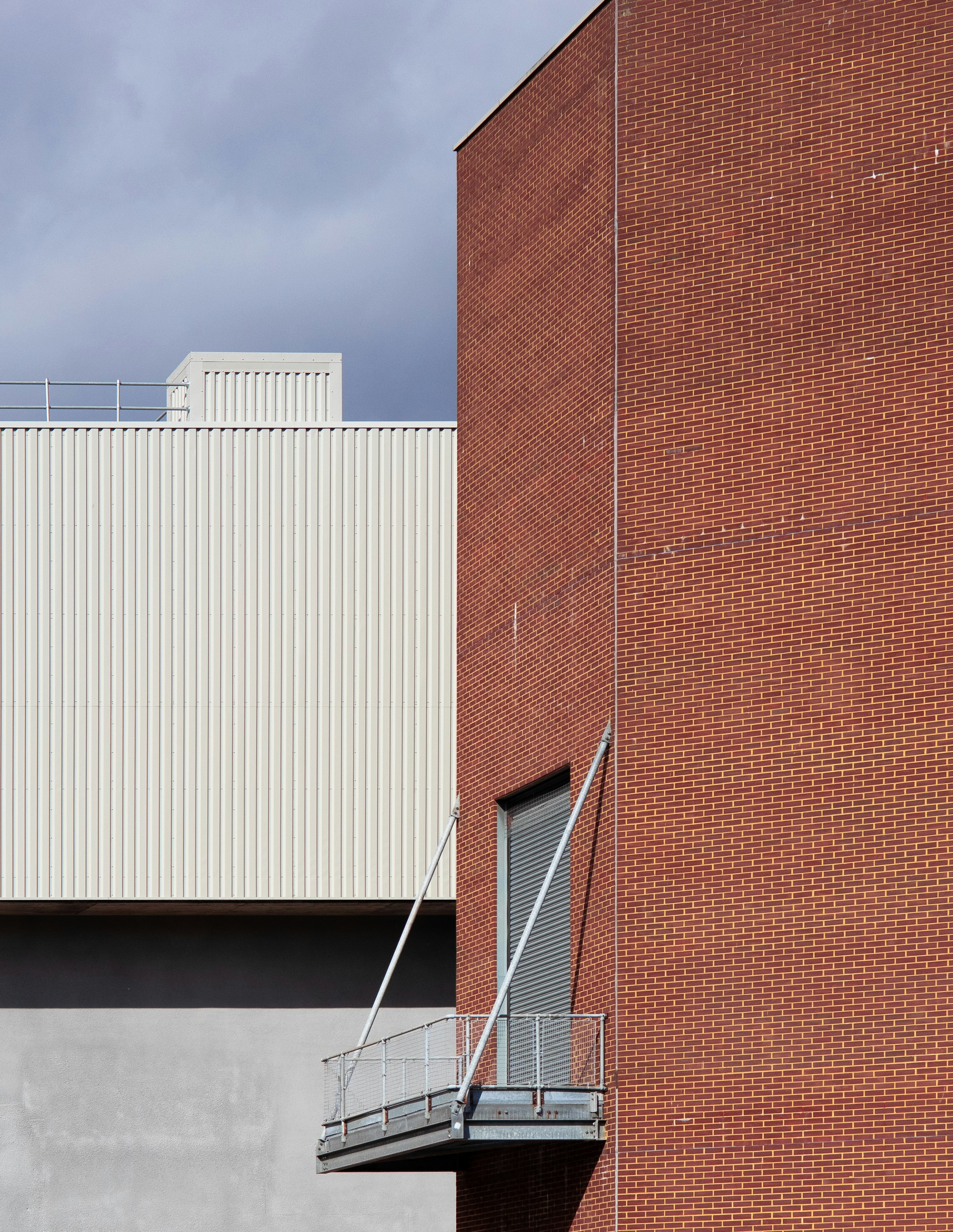 brown brick building under gray sky